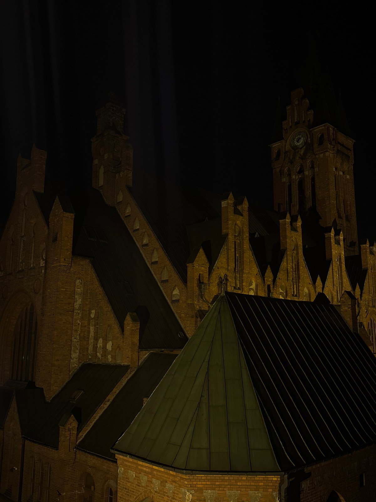 Nighttime scenes captured at Bydgoszcz cathedral and hotel room