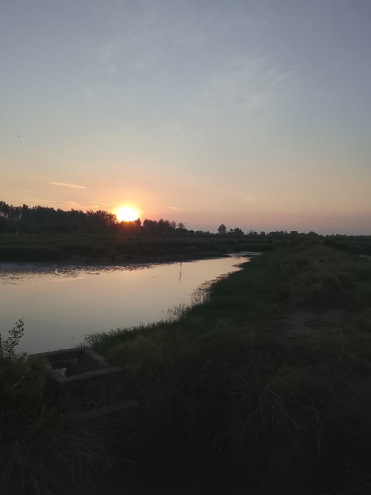 Sunset over quiet waterways near Mesjid Tuha, Indonesia