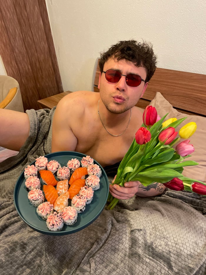 Man performs music in bed with Valentine's props in Montenegro