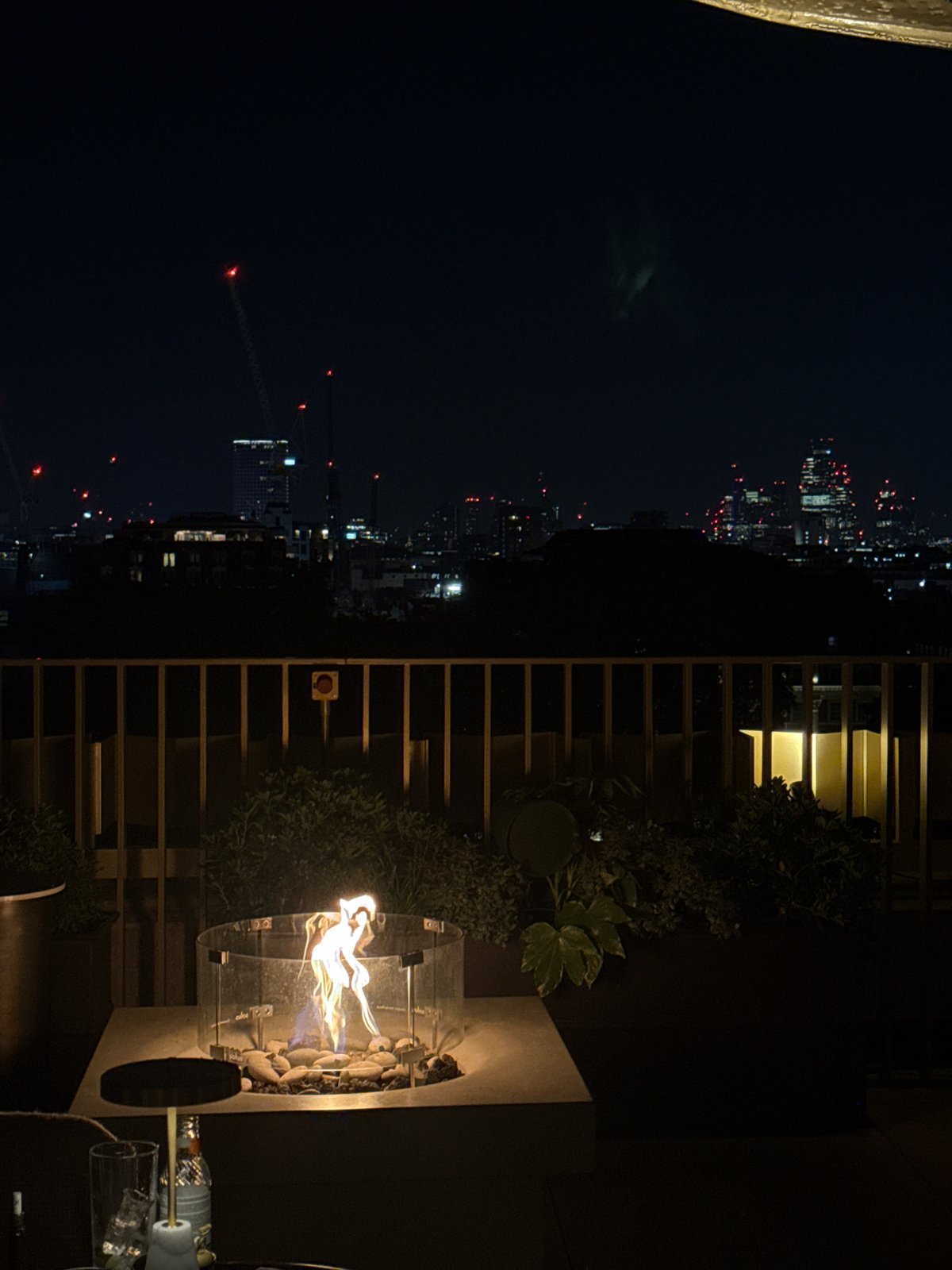 Evening rooftop gathering documented at upscale London venue