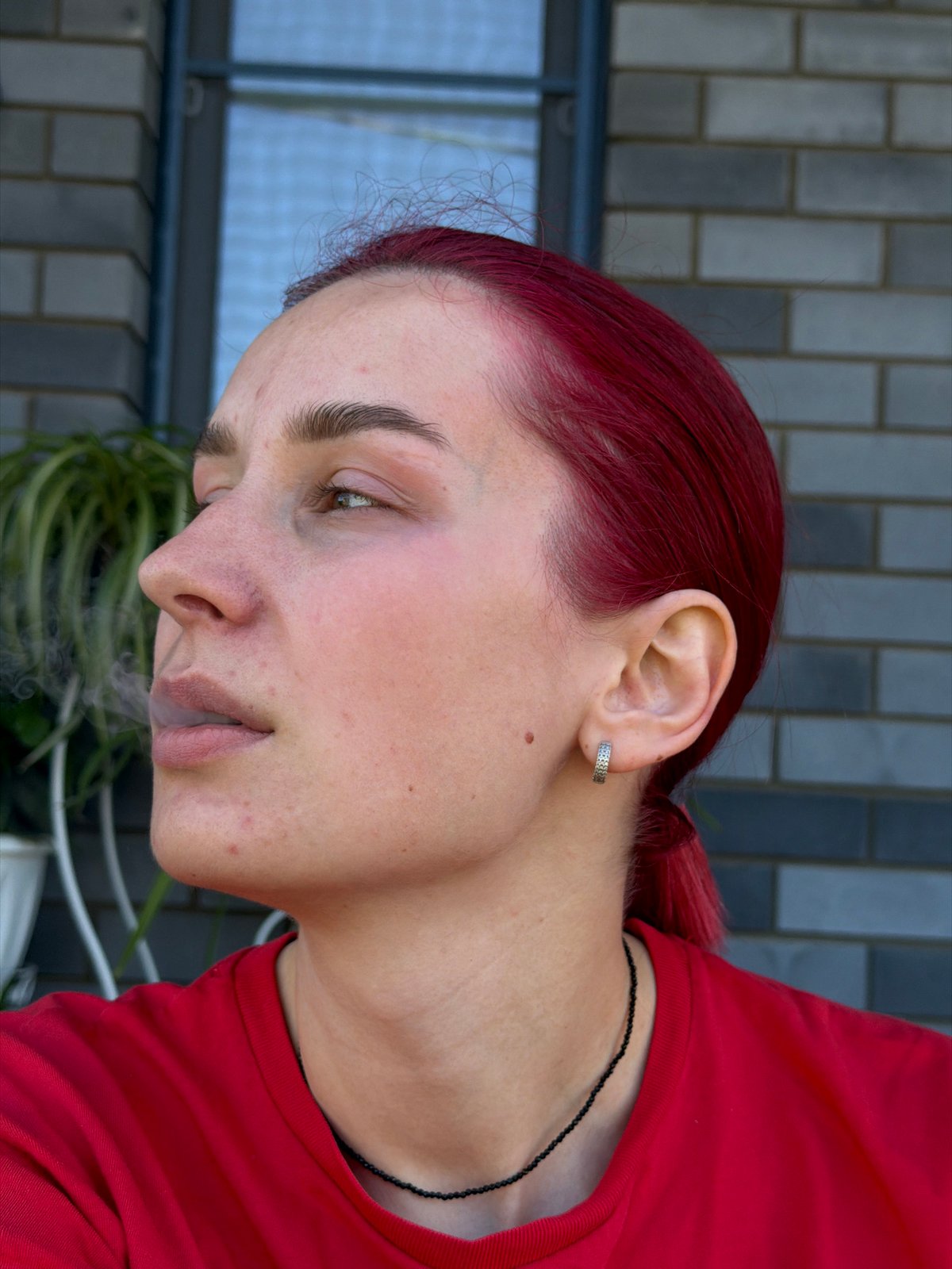 Red-haired woman vlogs with pets in Chaikovsky, Russia