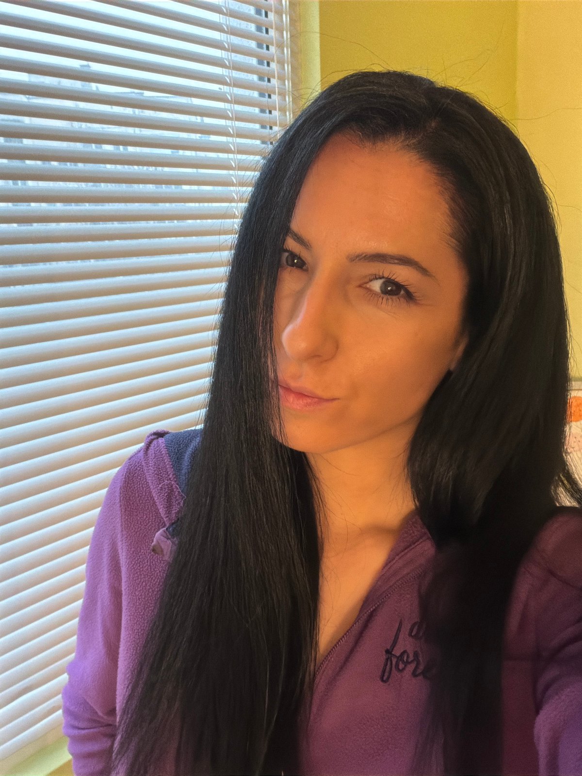 Woman in purple jacket photographed indoors in Pleven