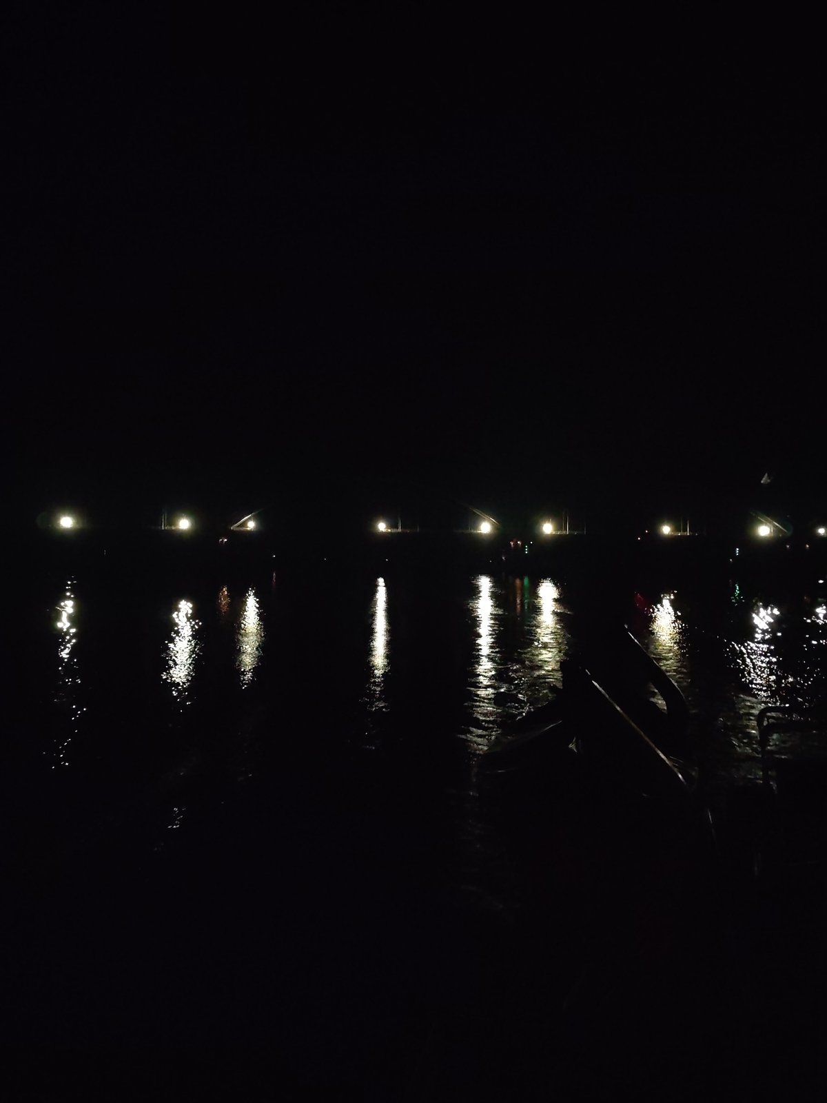Nighttime lights photographed across water near Gladyshevo, Russia