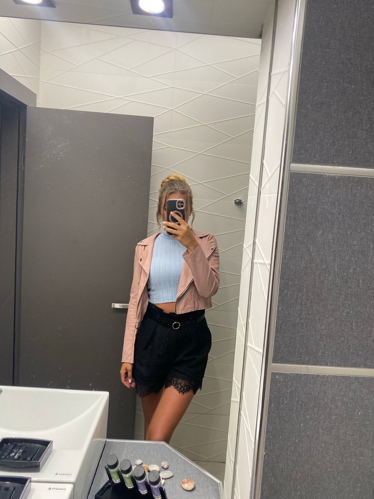 Woman takes mirror selfies at Ofrynio Beach facility