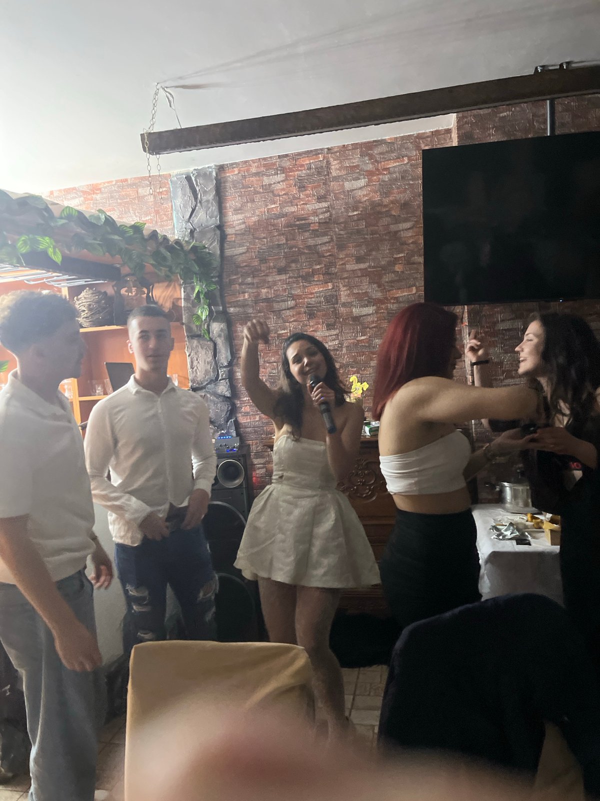 Indoor celebration with singing and dancing in Zlatograd, Bulgaria