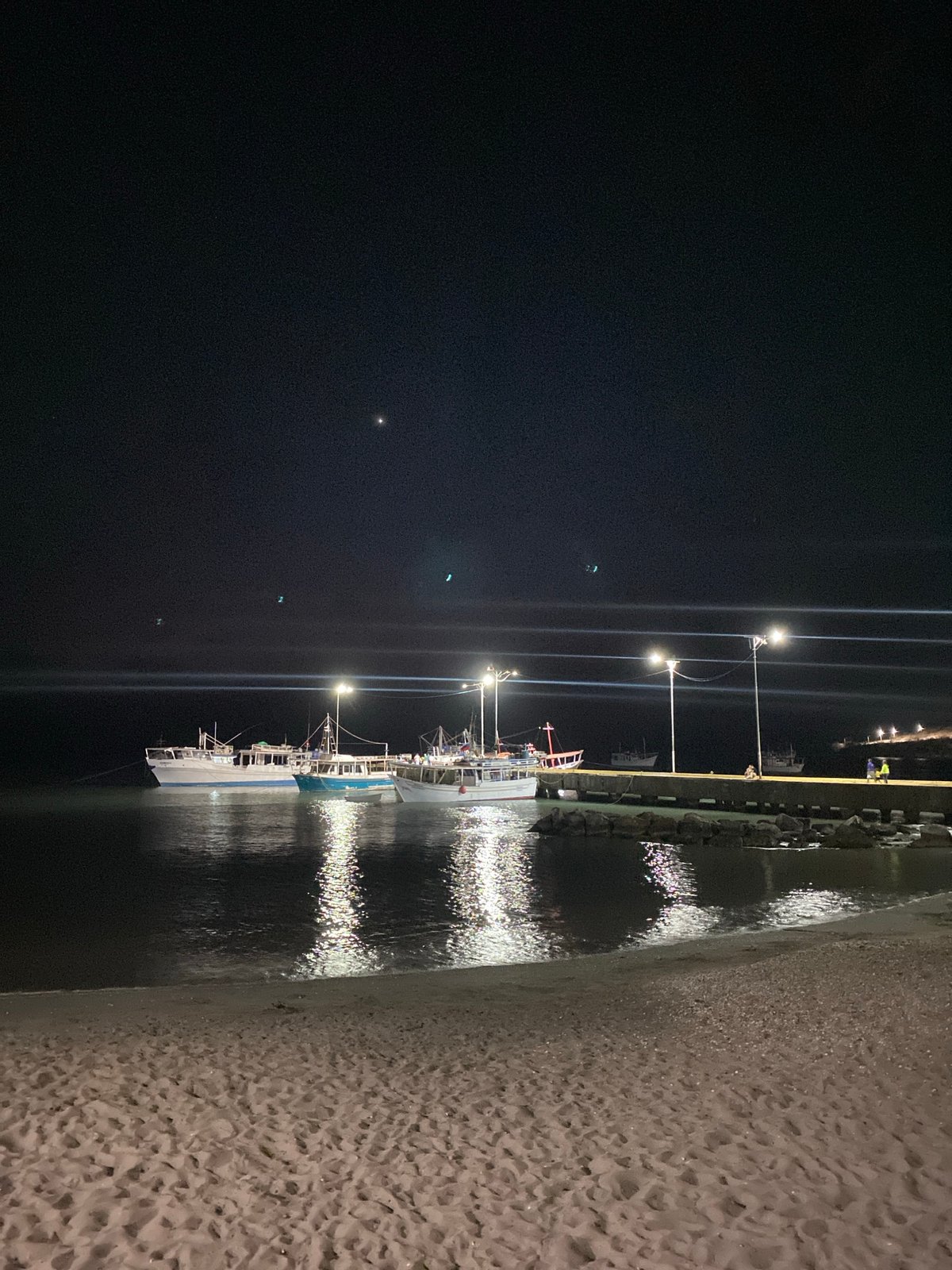Evening pier activity documented in Juan Griego, Venezuela