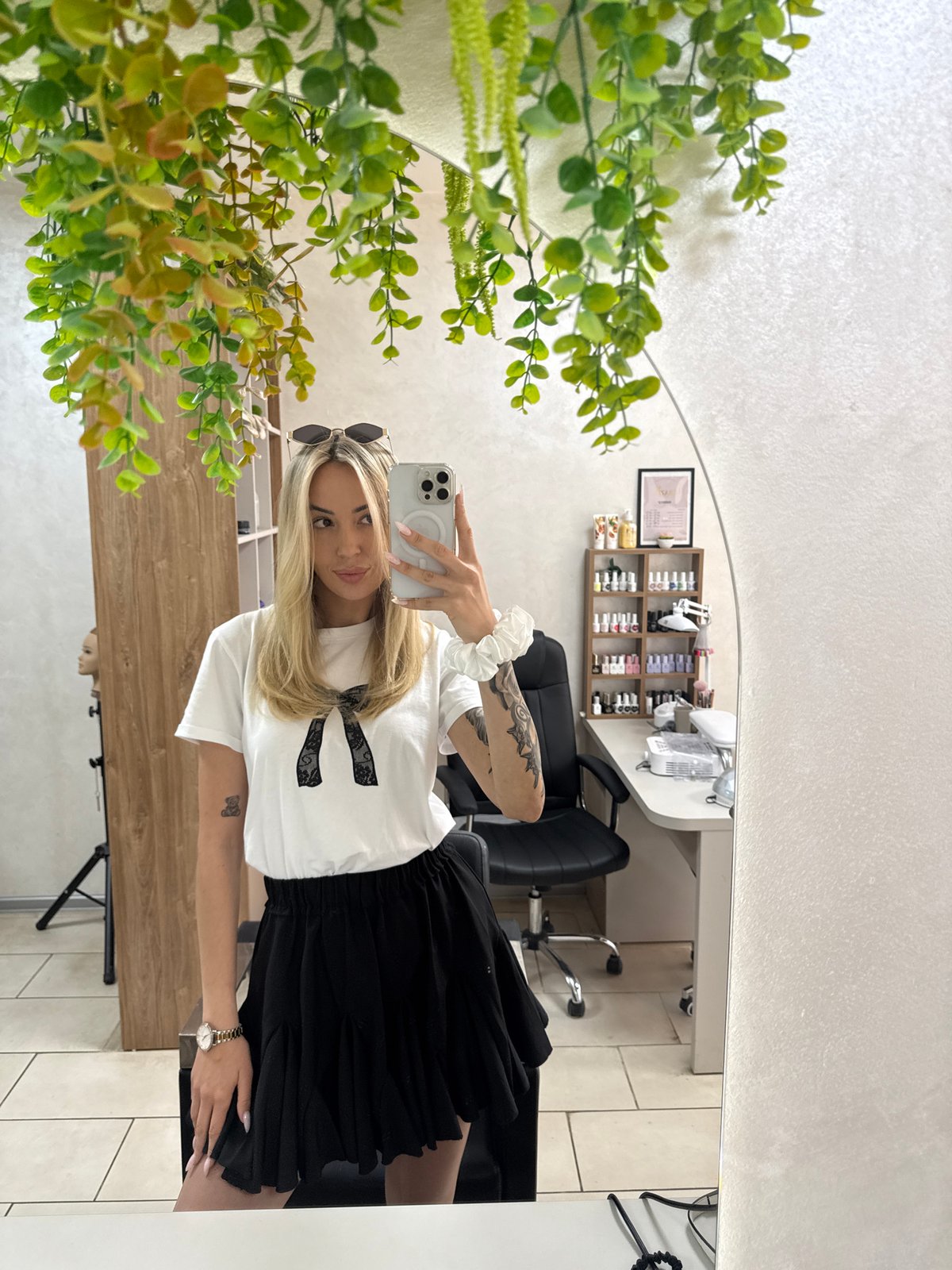 Woman takes mirror selfies at salon in Ruse, Bulgaria