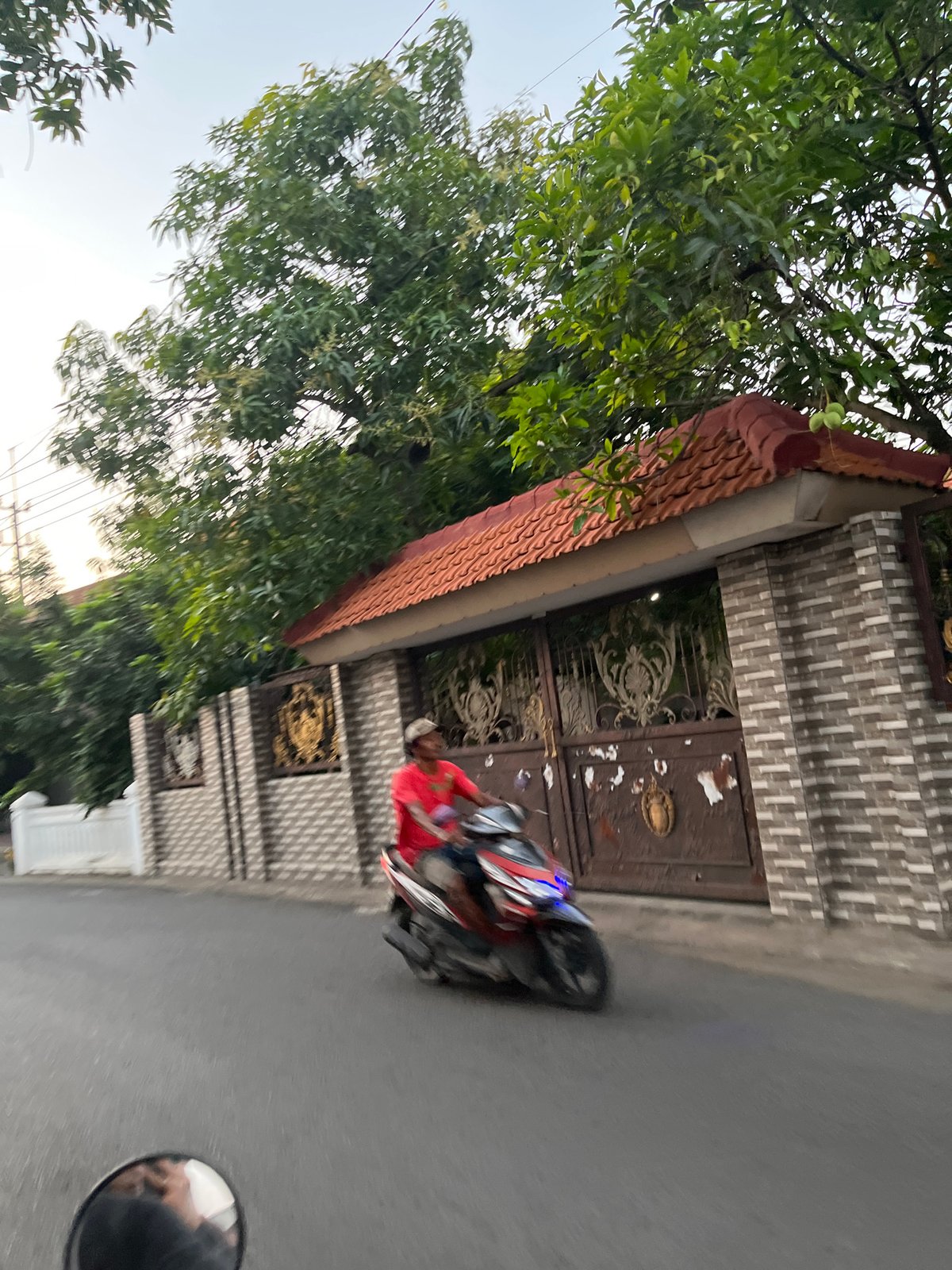 Morning street life across two East Java neighborhoods