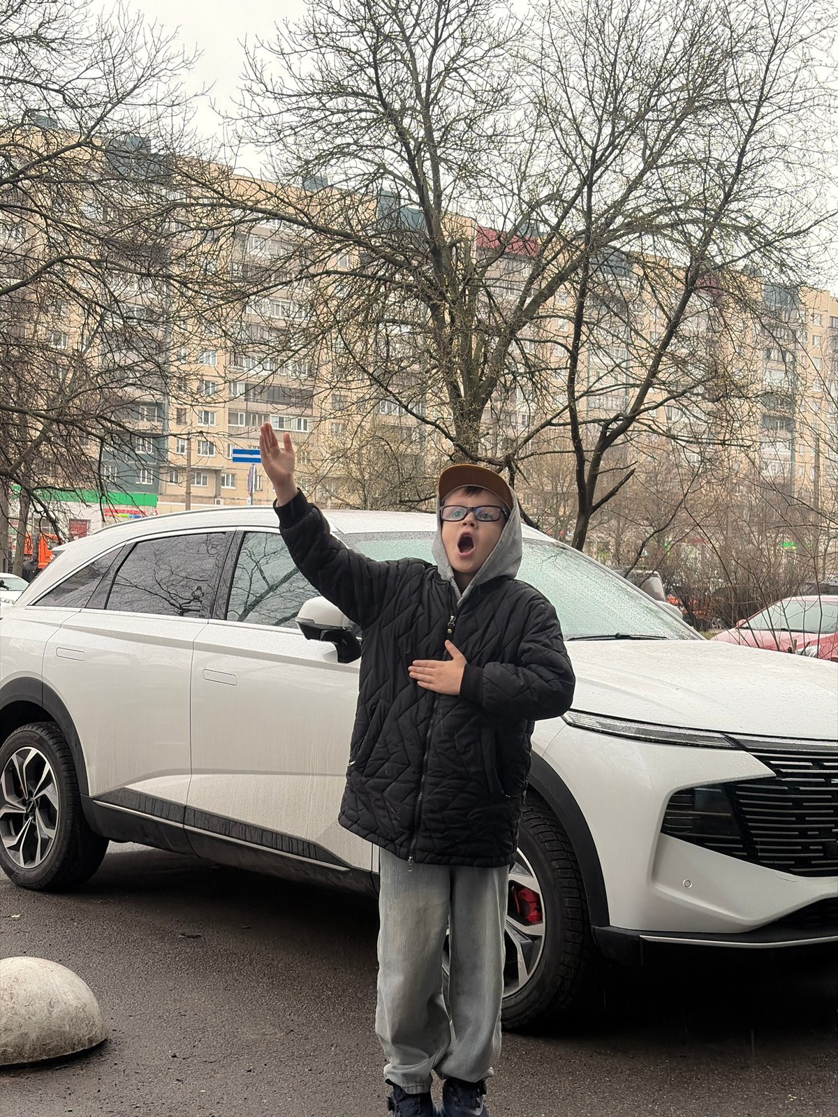 Family car trip through rainy Saint Petersburg streets