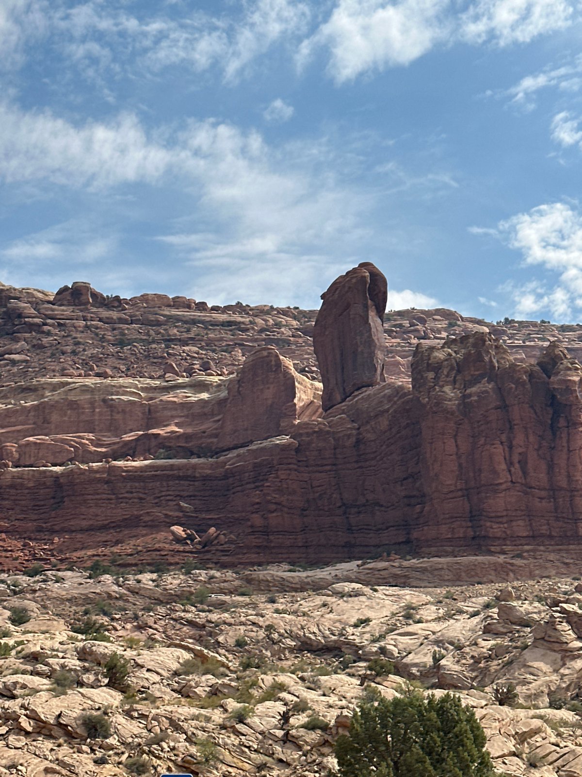 Red rock formations and open road outside Moab, Utah