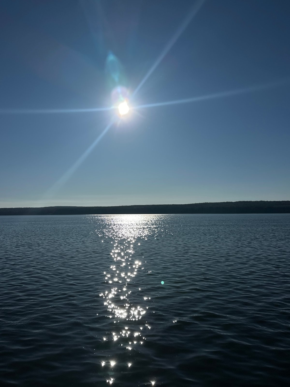 Dawn reflection photographed on water near Chaikovsky, Russia