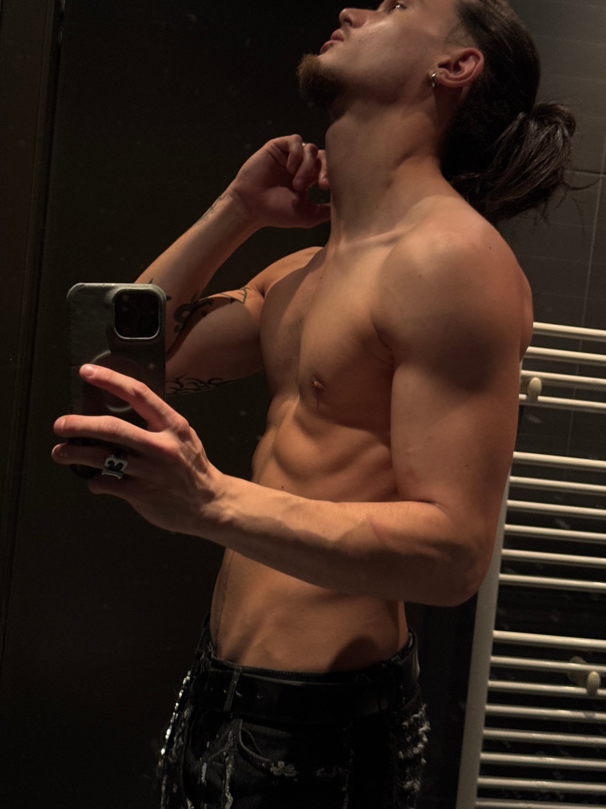 Man takes mirror selfie in Sofia bathroom