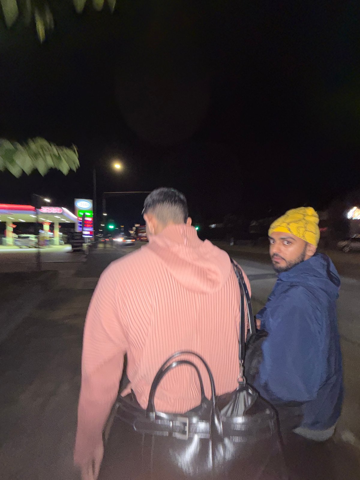 Two people spotted at London Esso station showing fuel prices