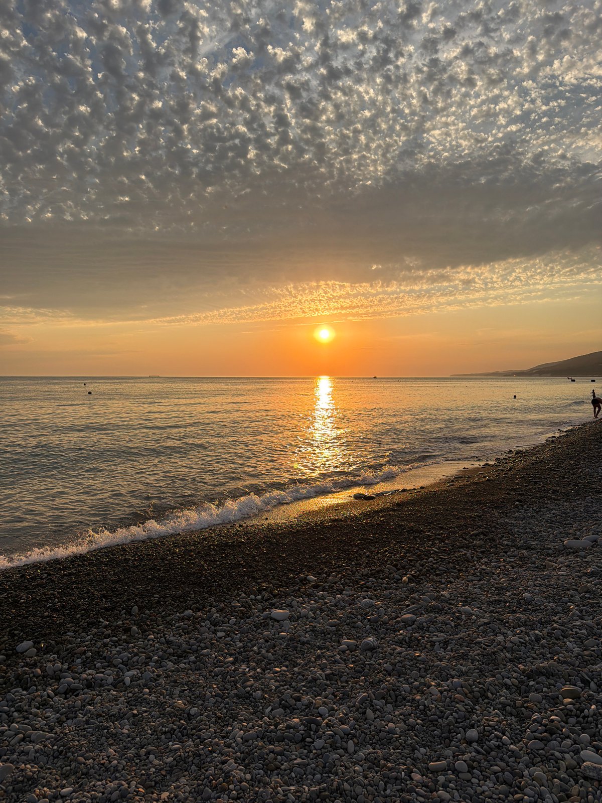 Sunset evening on Sochi's Black Sea pebble beach