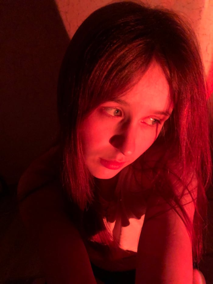 Woman documents personal moments with pets in Russian home