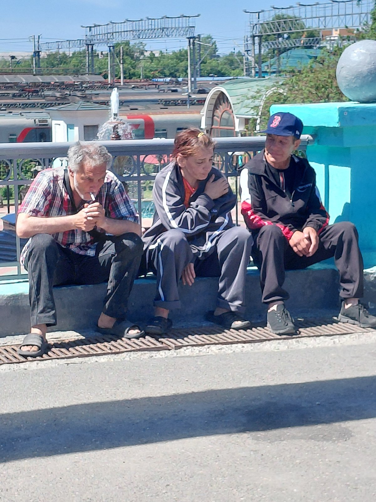 A Russian suburban train station buzzing with midday activity