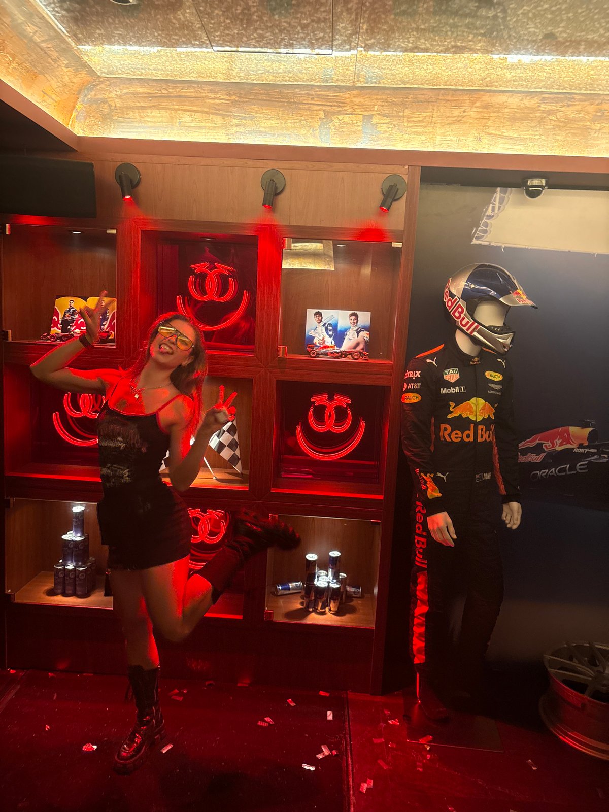 Woman poses at Red Bull Racing display in Hong Kong