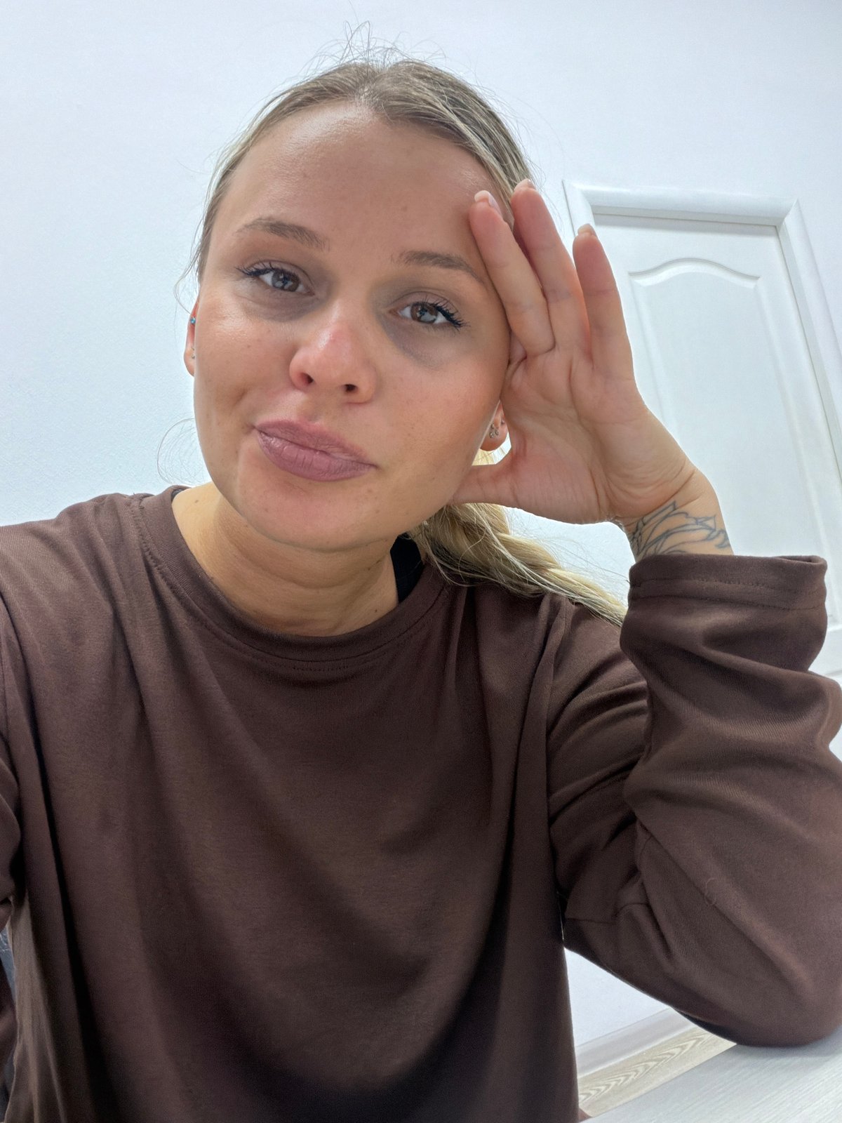 Woman photographed in multiple poses indoors in Sarapul, Russia