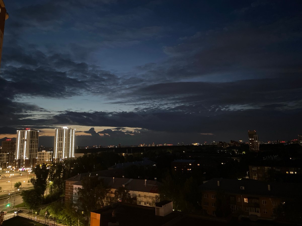 Perm skyline moves through dusk to night under crescent moon
