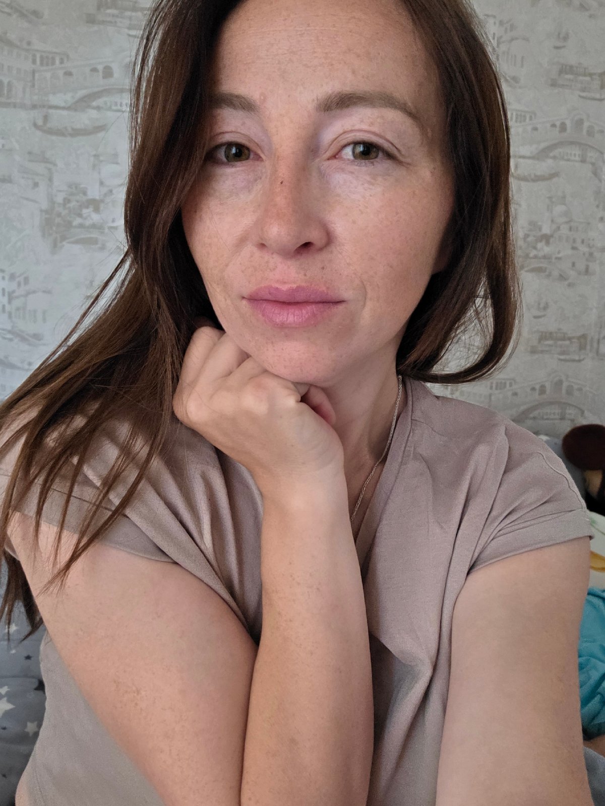 Woman photographed in bedroom poses in Chaikovsky, Russia