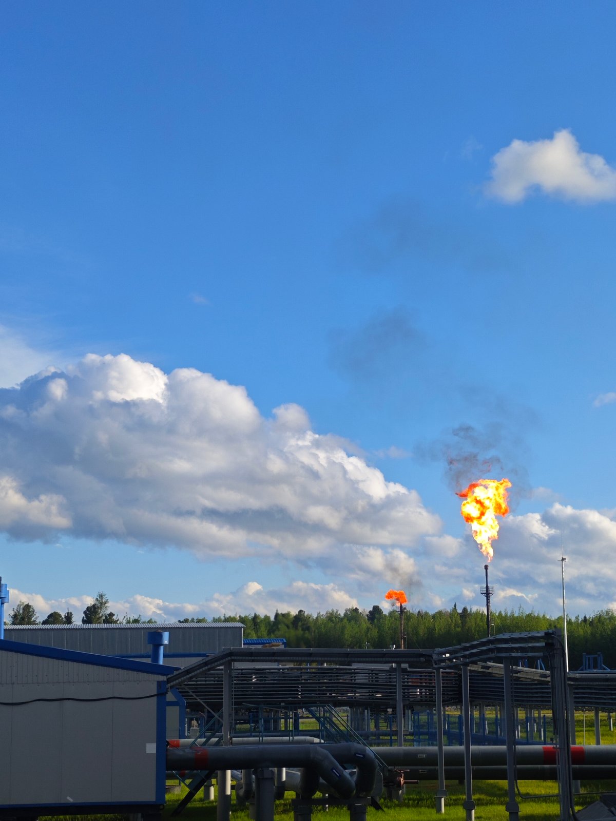 Industrial plant operator monitors facility systems from control room