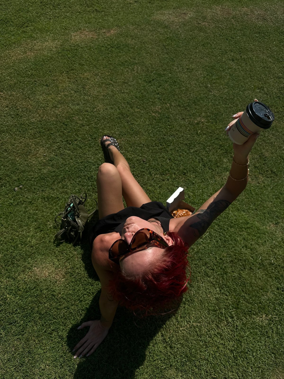 Woman enjoys outdoor meal on Indonesian lawn