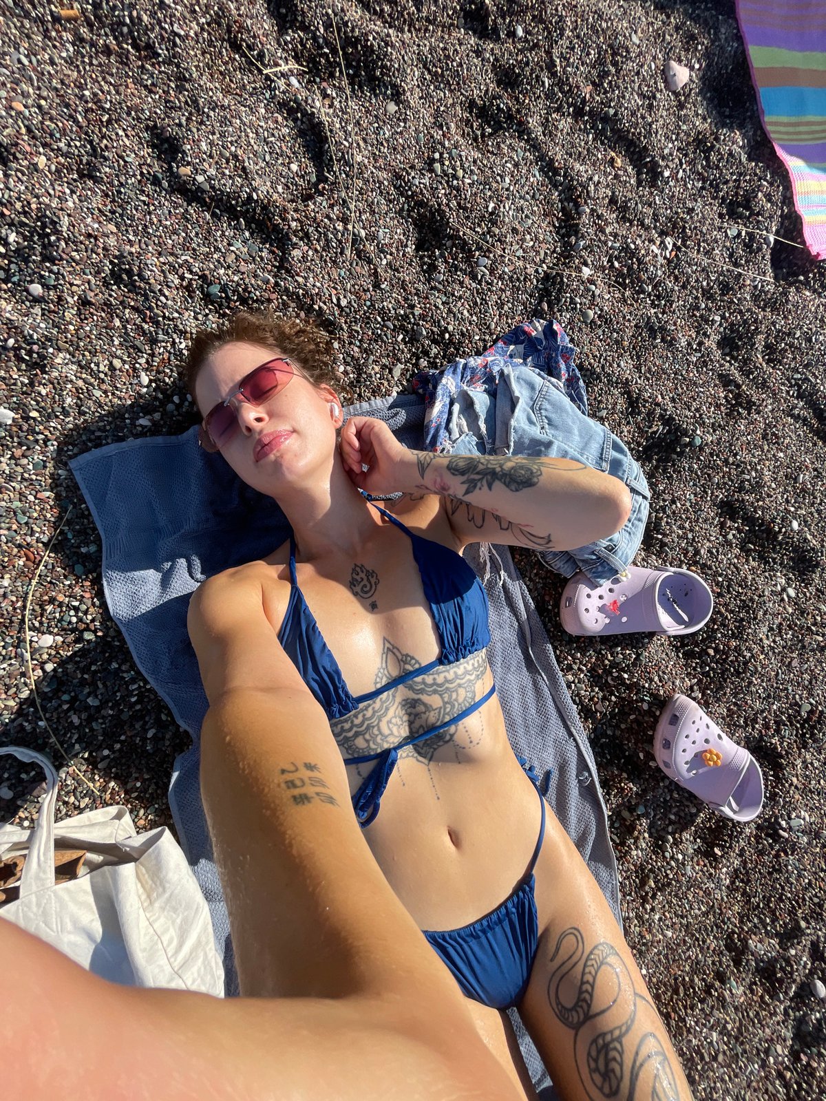 Relaxing on a pebble beach in Rafailovići, Montenegro