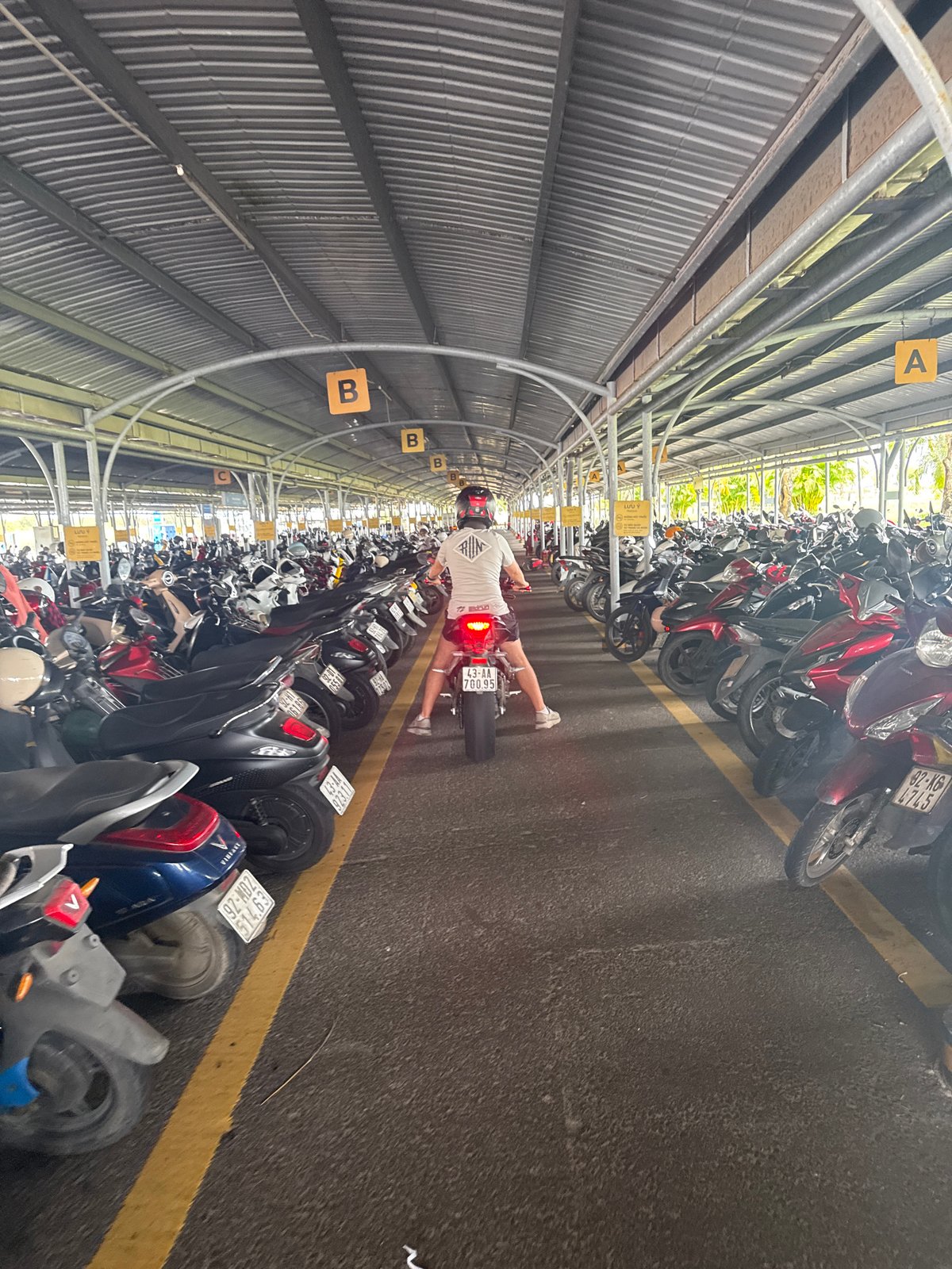 Covered motorcycle parking facility observed in Đà Nẵng, Vietnam