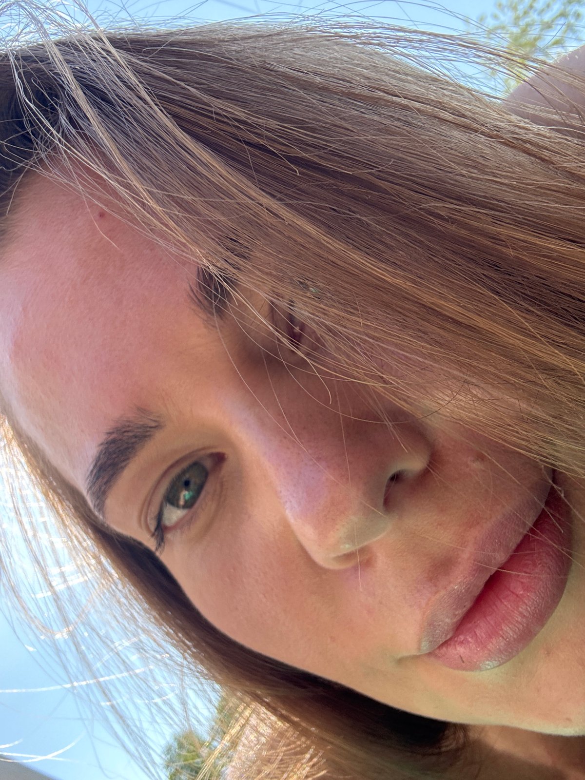 Woman takes selfies outdoors in Sosnovy, Russia