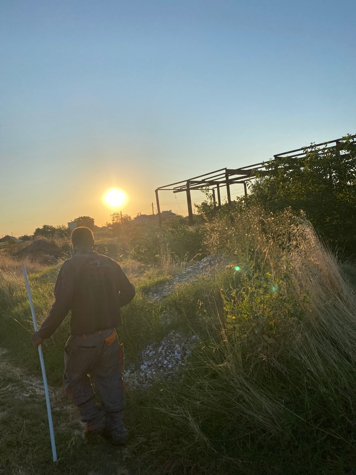Walking into a golden sunset across Bulgarian fields