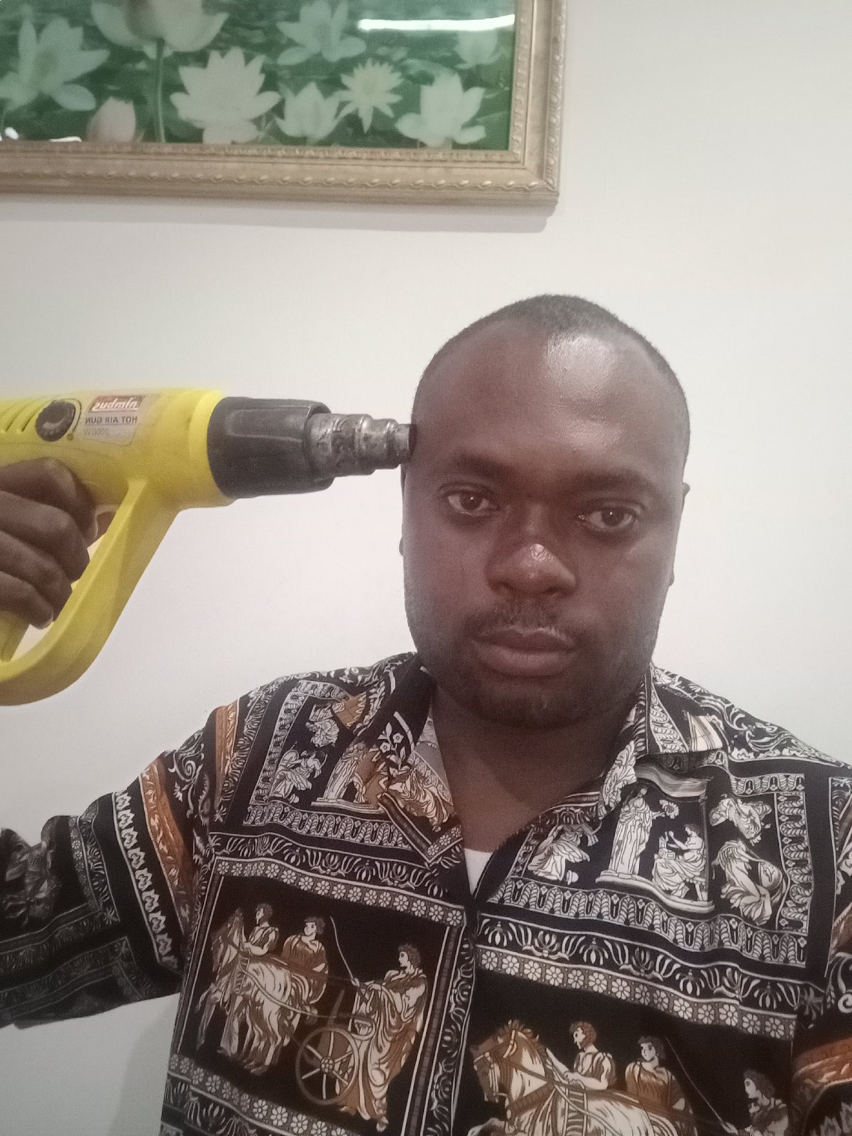 Man photographed indoors in Gwarinpa, Nigeria