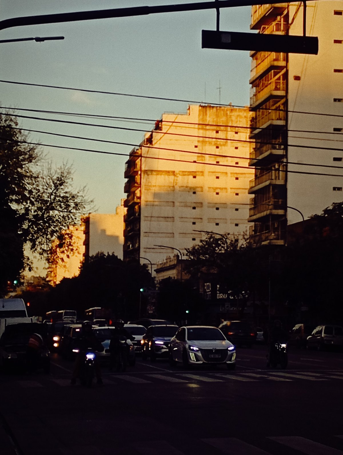 Emergency ambulance responds through Buenos Aires streets at dusk