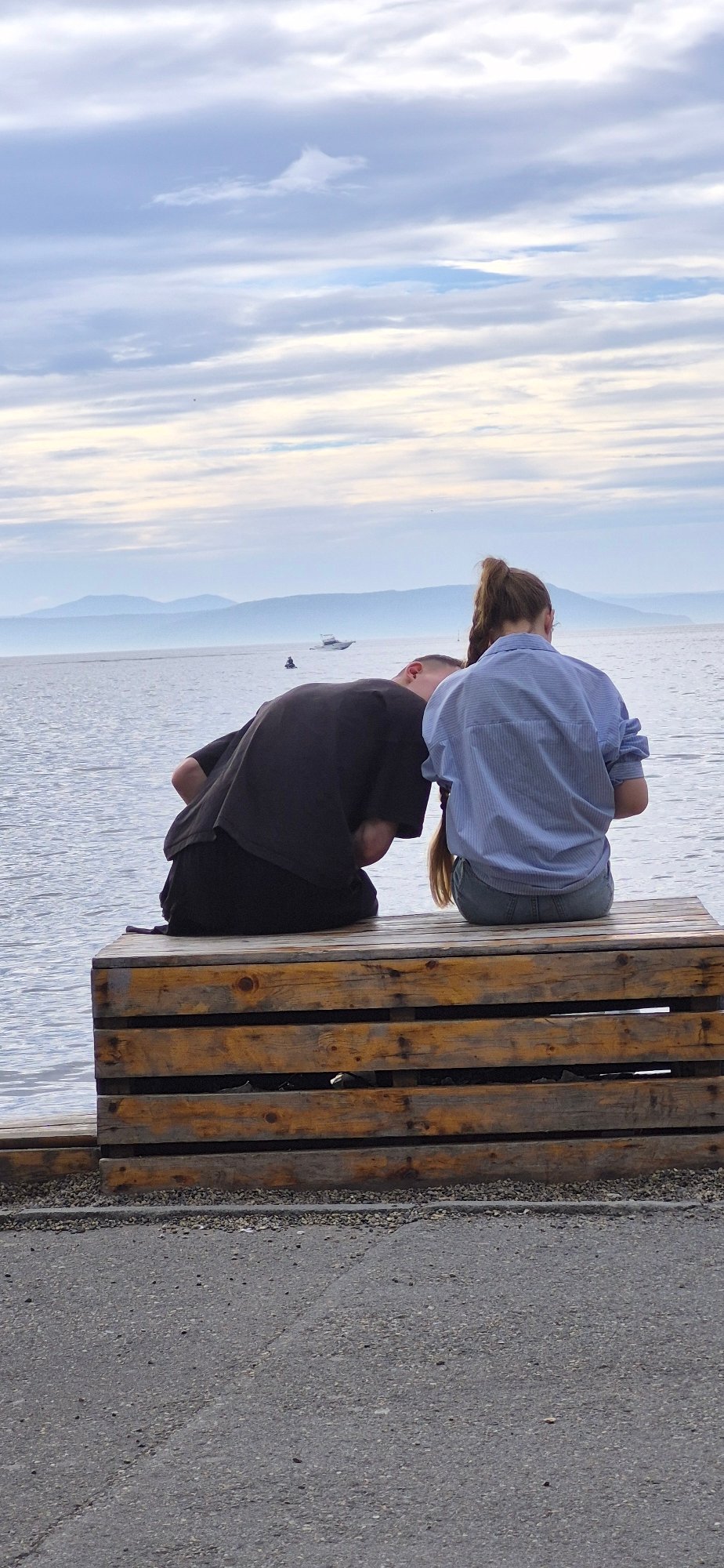 Quiet morning at a Vladivostok waterfront, boats and benches