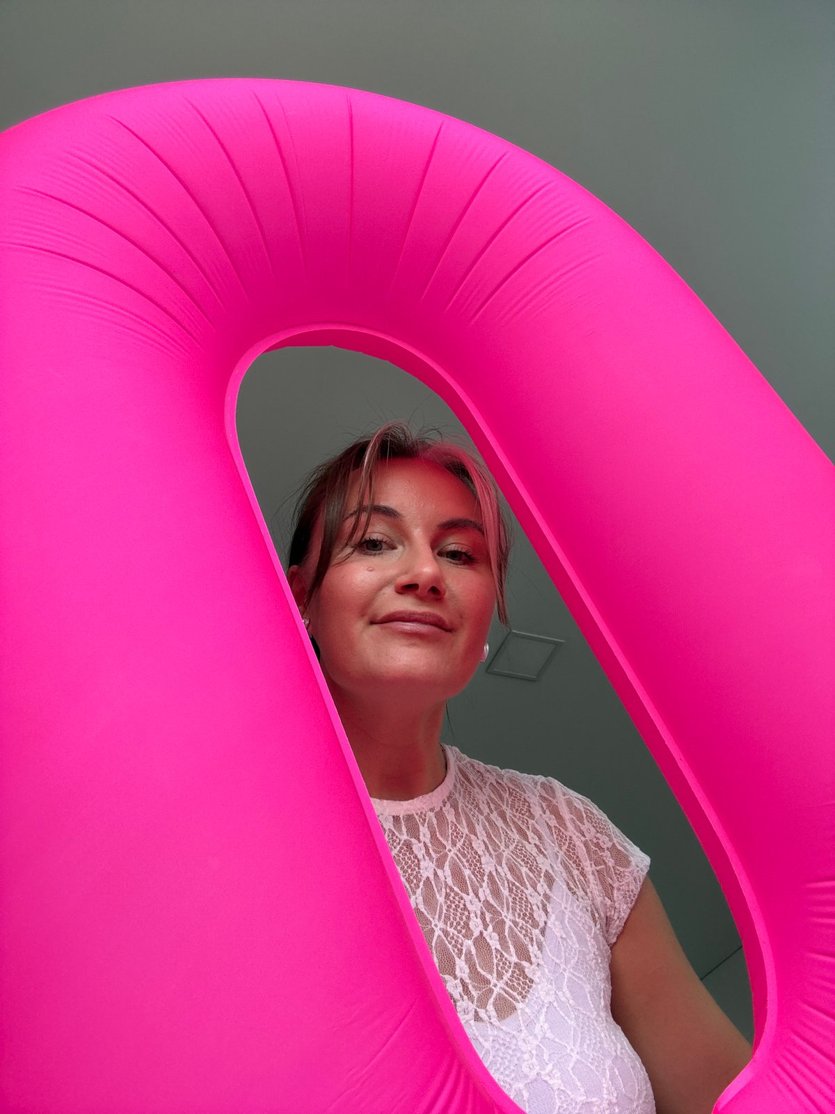 Woman photographed with pink inflatable object in Chaikovsky, Russia