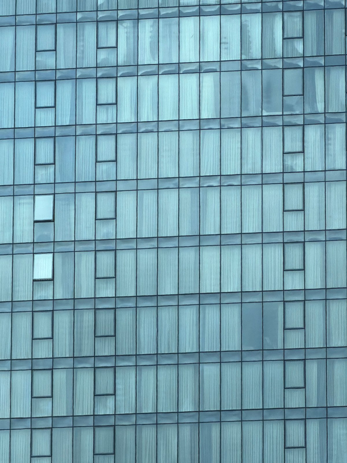 Building facade with grid-pattern windows documented in Tbilisi