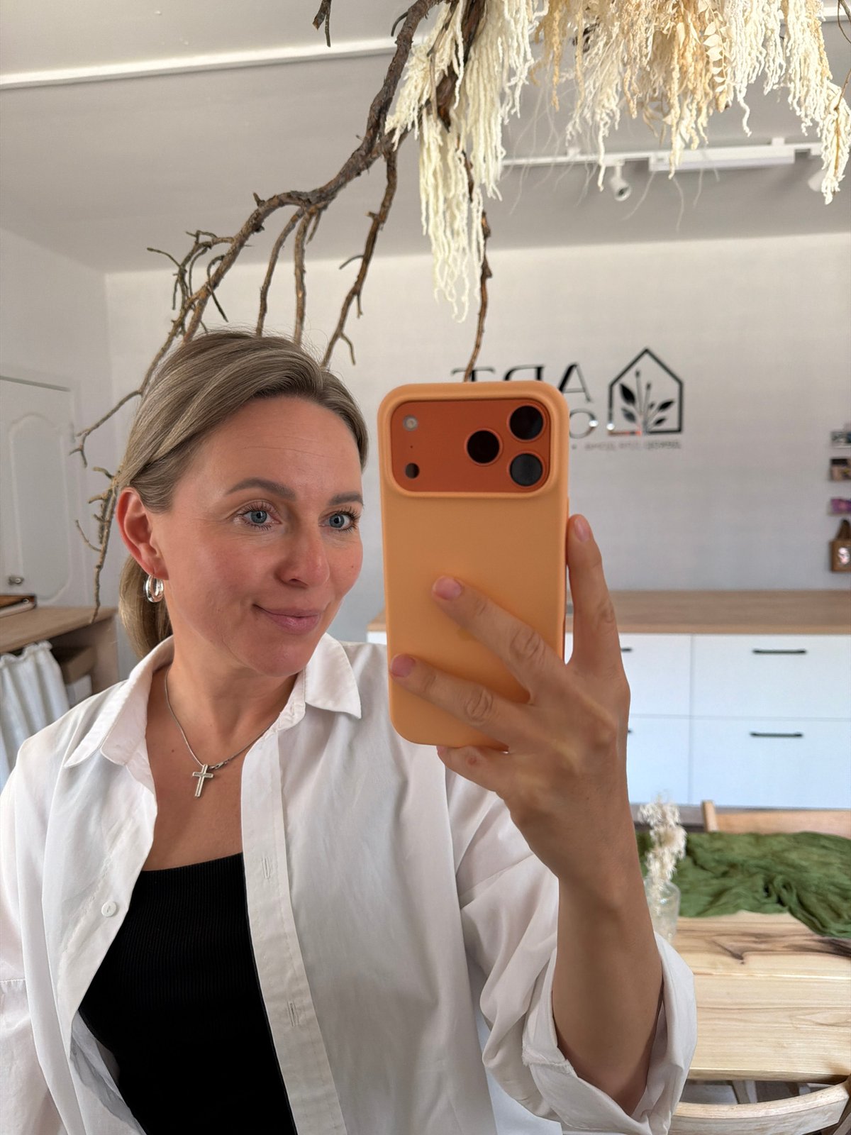 Woman documents cafe visit with selfies in Chaikovsky, Russia