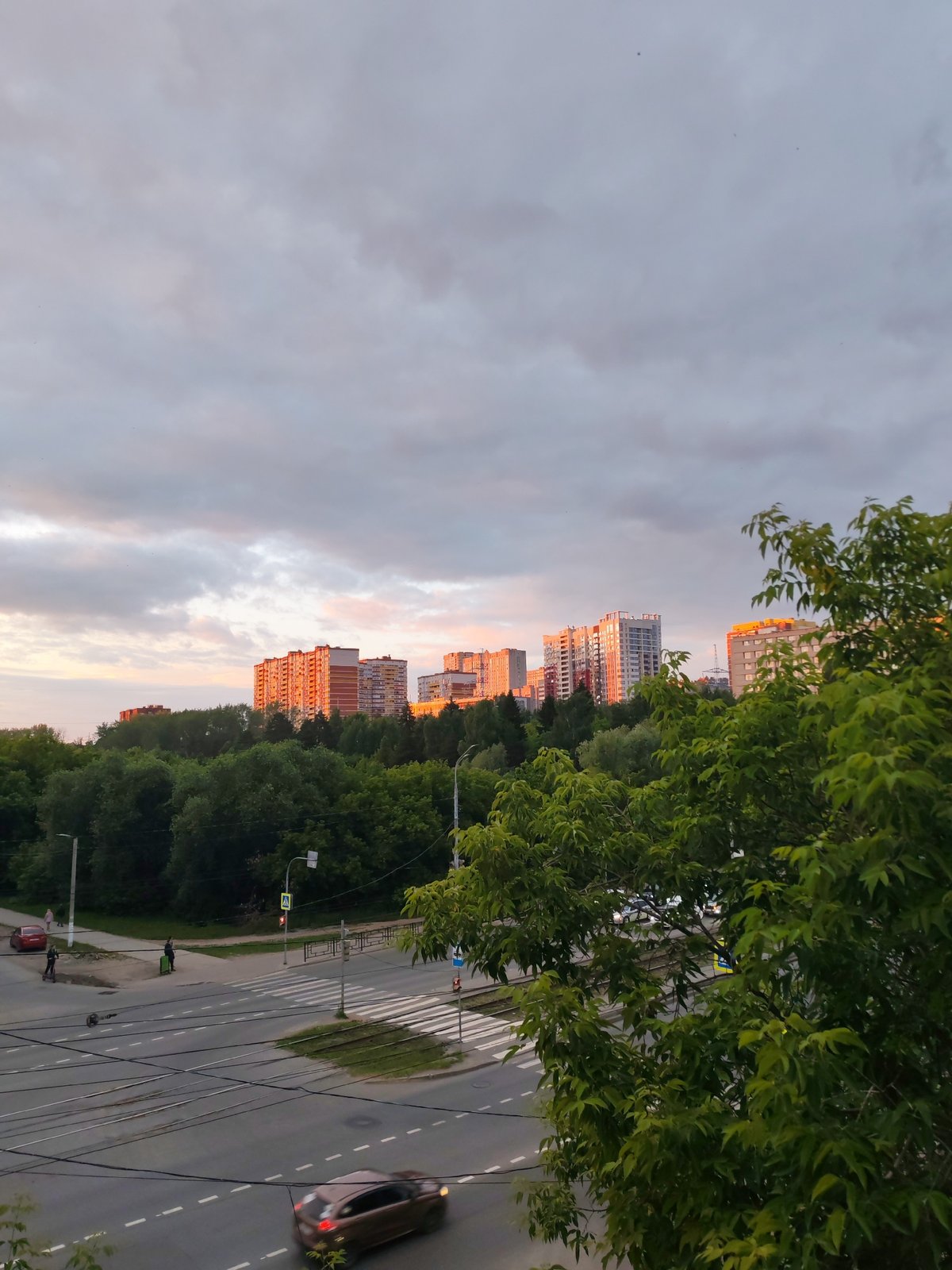Golden hour sunset documented across Izhevsk streets and buildings
