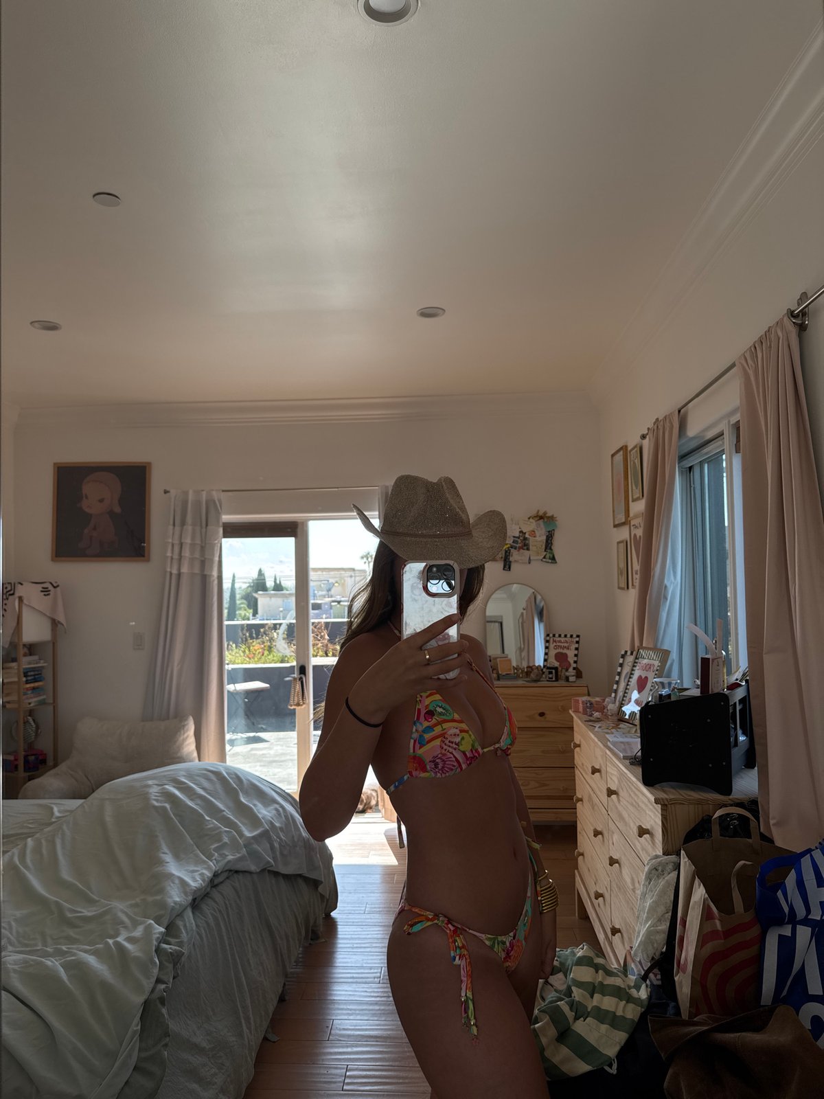 Woman Takes Mirror Selfie in Bikini and Cowboy Hat