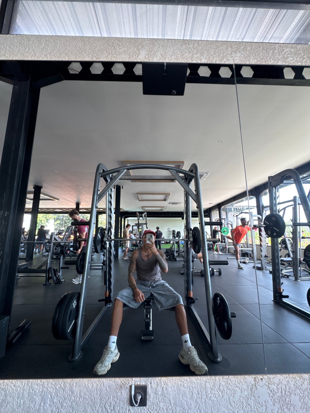 Gym mirror selfie on a weight bench in Kuta Selatan