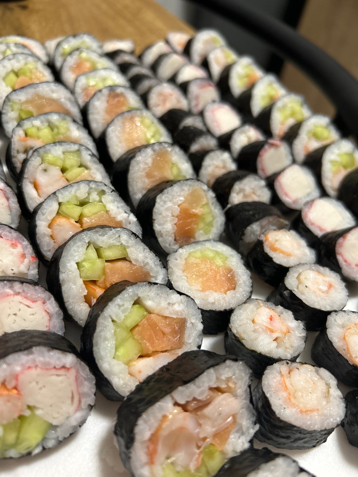 Overhead look at a large maki roll spread in Szczecin