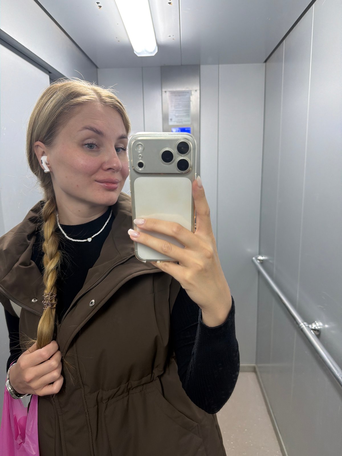 Woman takes selfie in elevator in Chaikovsky, Russia