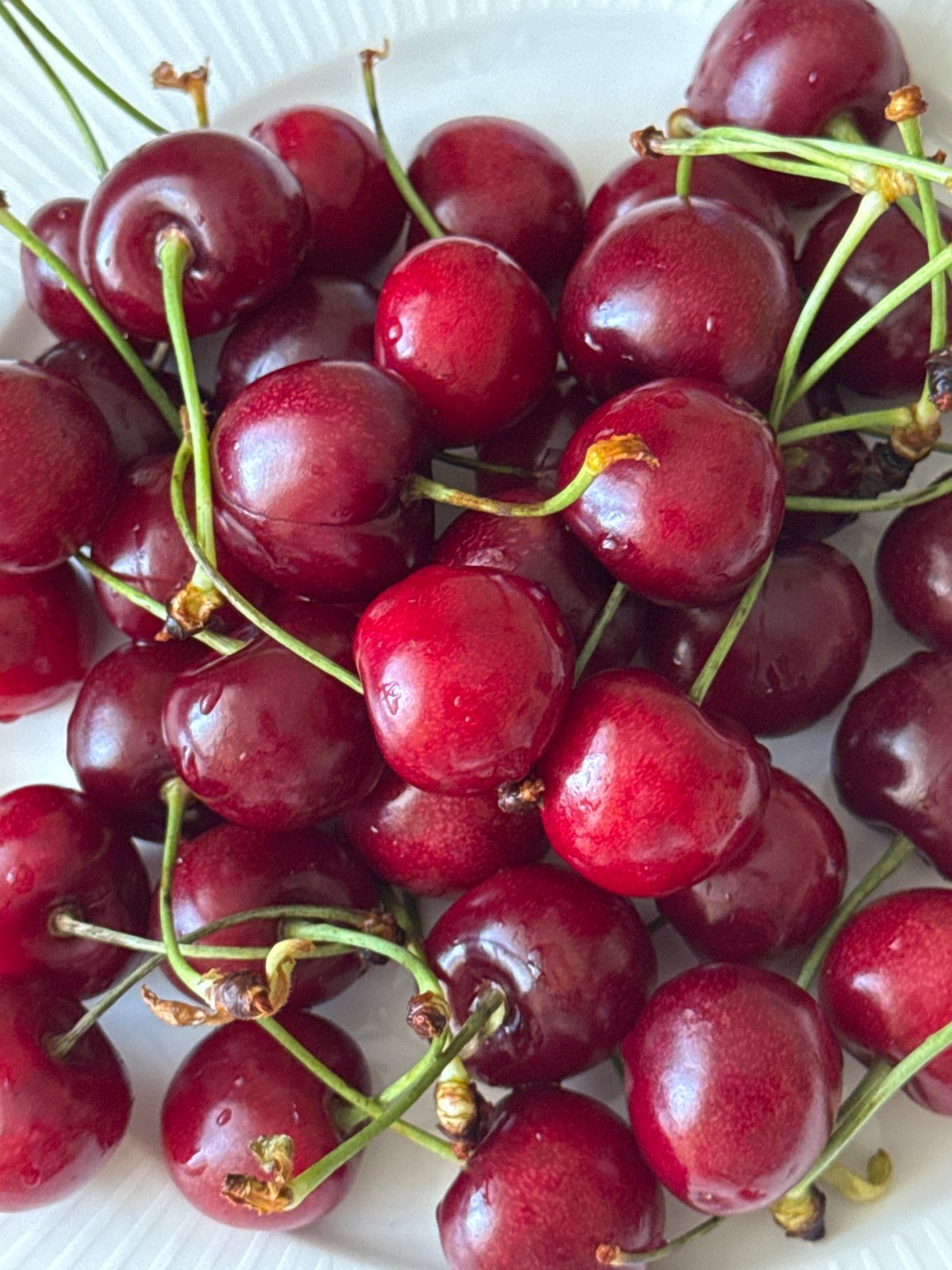 Fresh cherries and wall paintings captured in Saint Petersburg