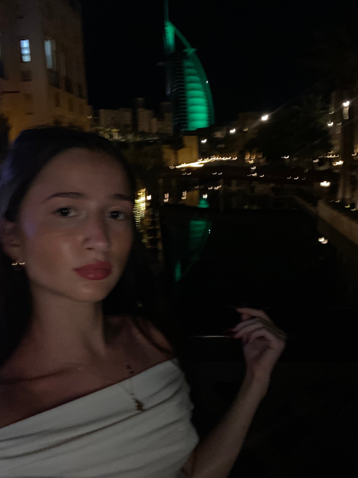 Dubai landmarks glow green during evening photo sessions