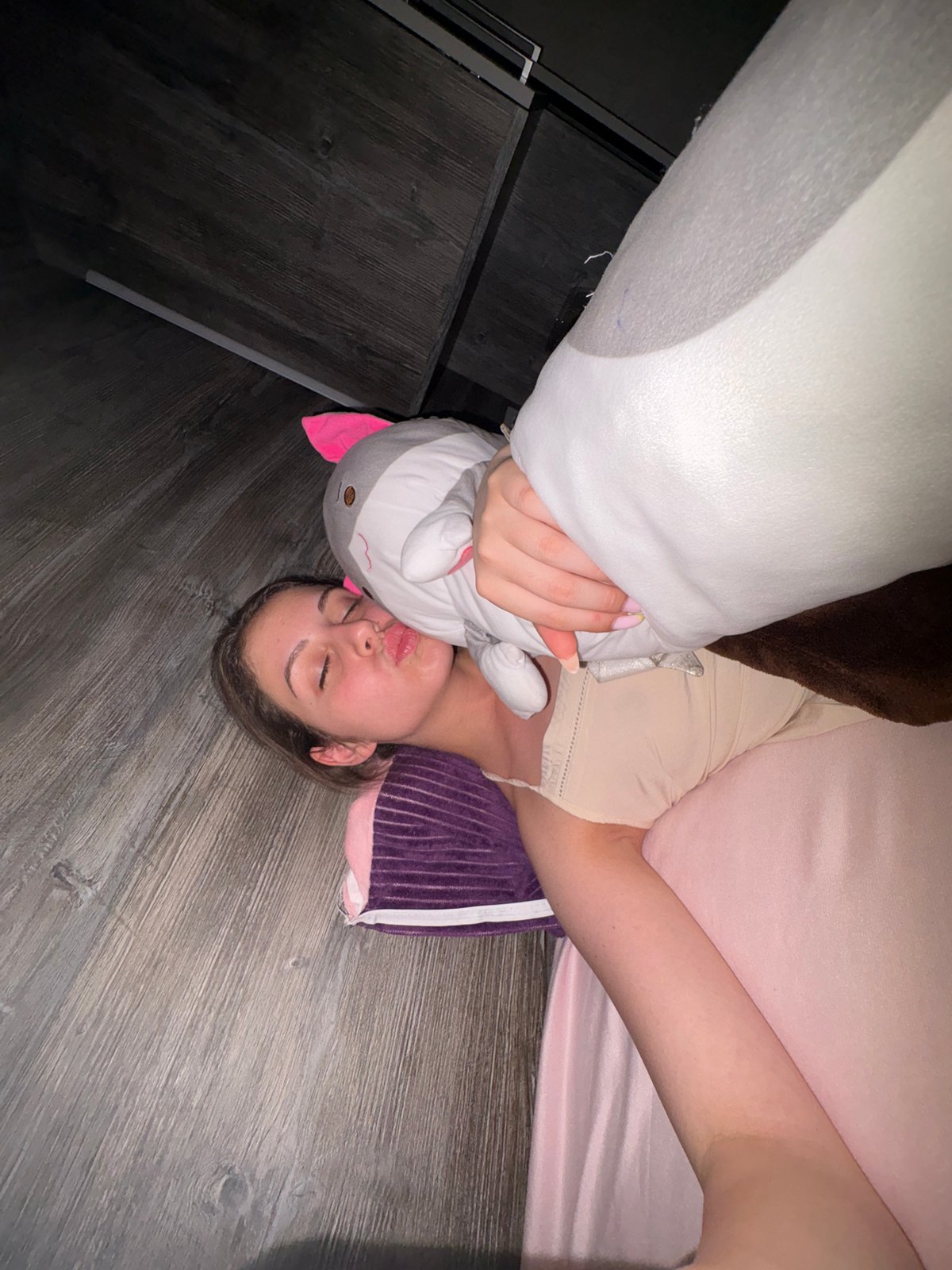 Woman photographed resting indoors during evening in Bulgarovo, Bulgaria