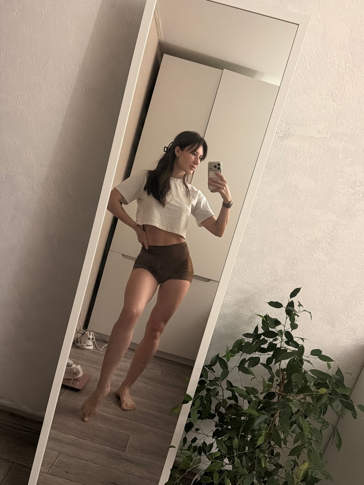 Woman takes mirror selfie in Perm residence