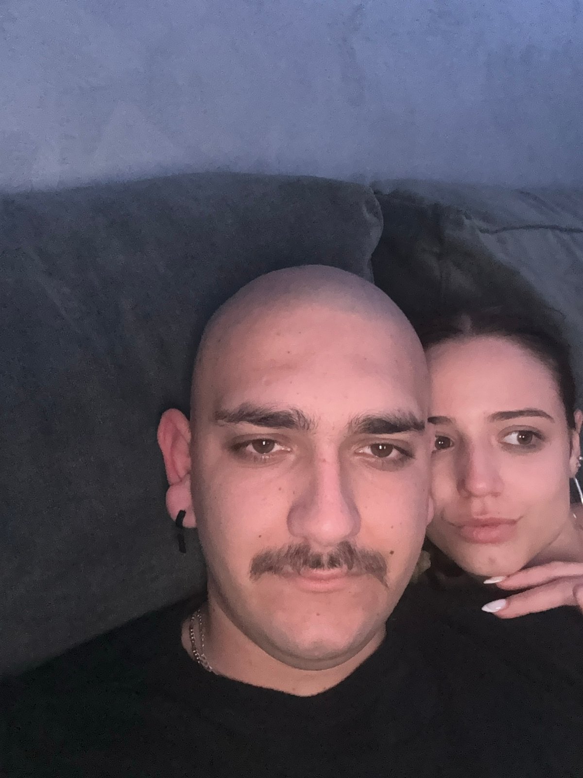 Couple photographed resting on couch in Pernik, Bulgaria