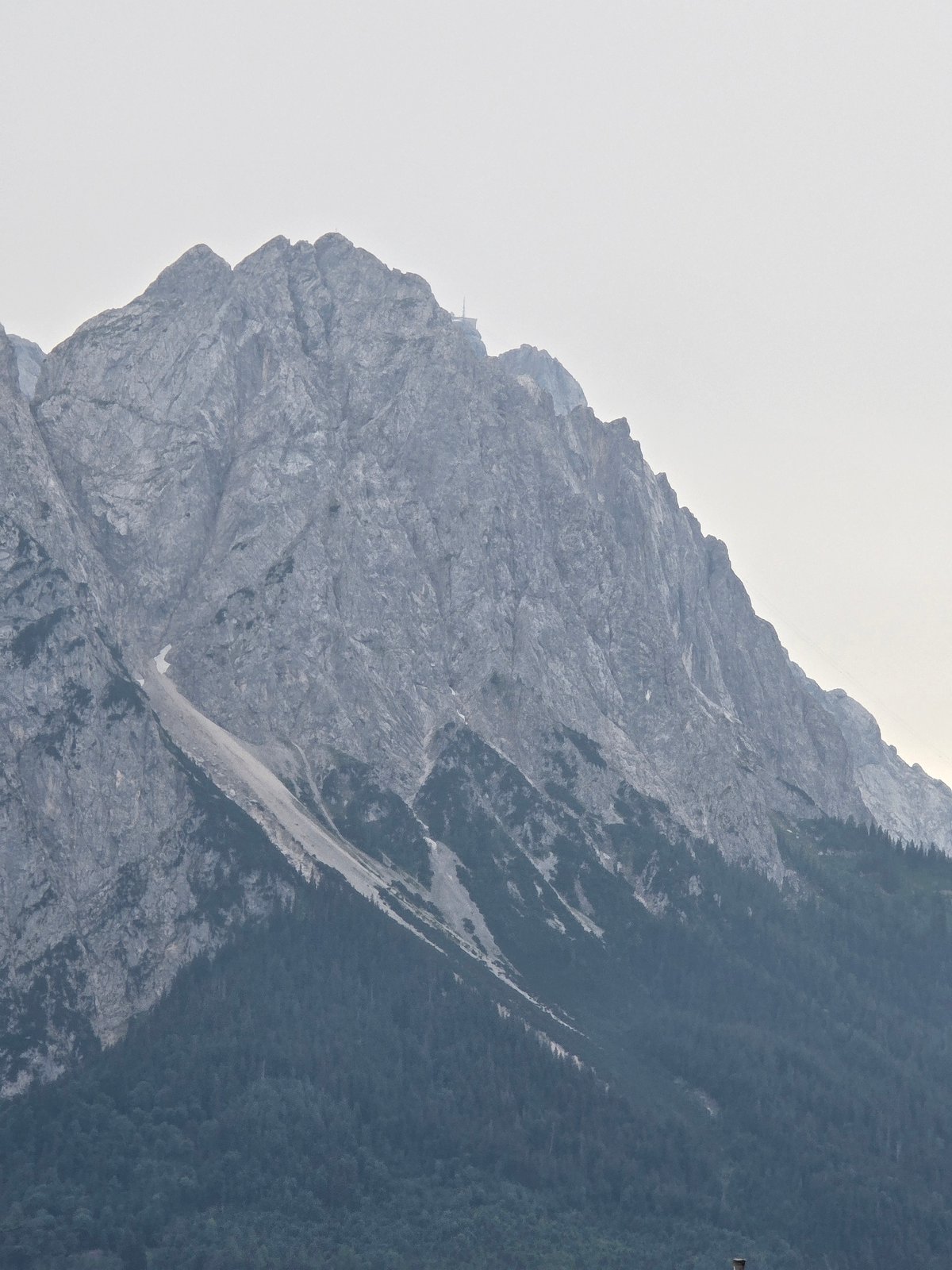 Garmisch-Partenkirchen from rooftop to ridgeline, dusk closing in