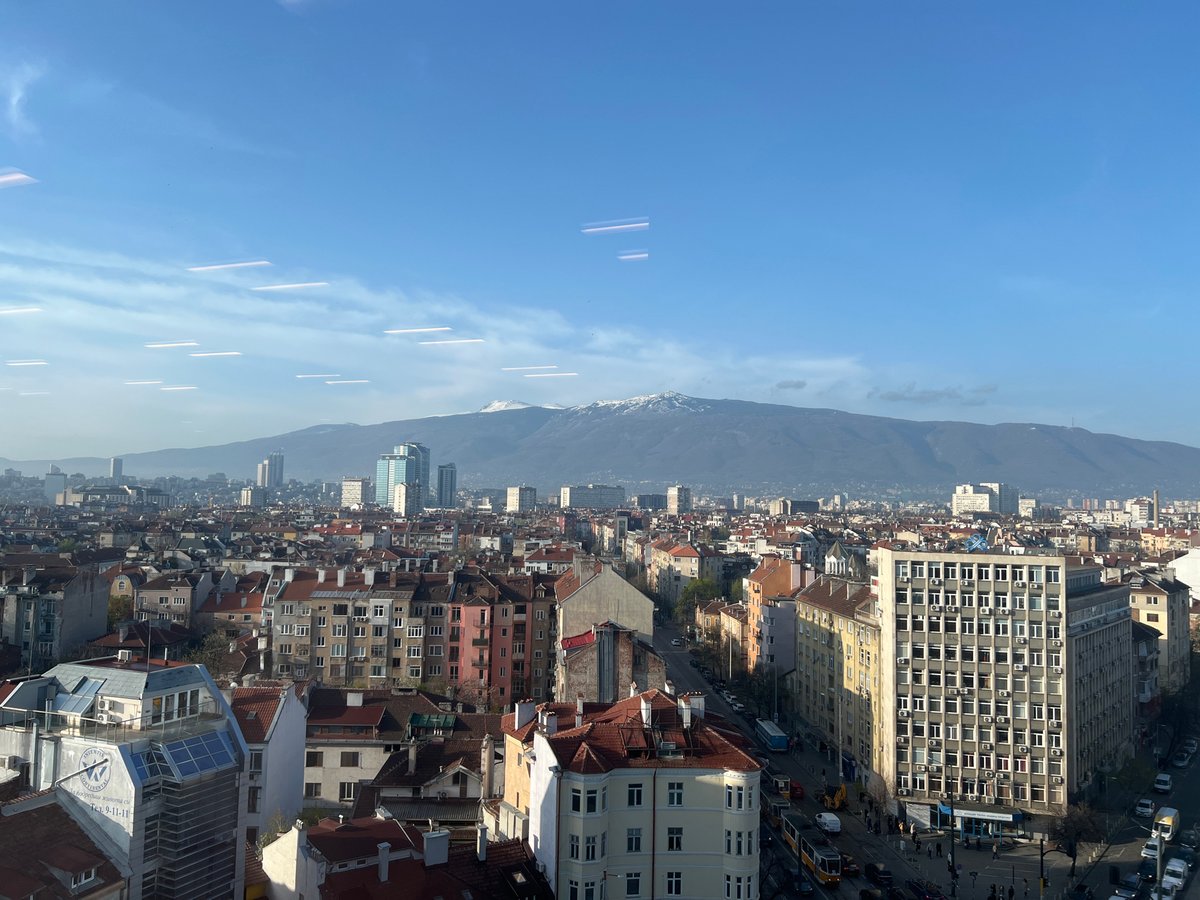 Dawn panoramic view captures Sofia cityscape with snowy Vitosha Mountain