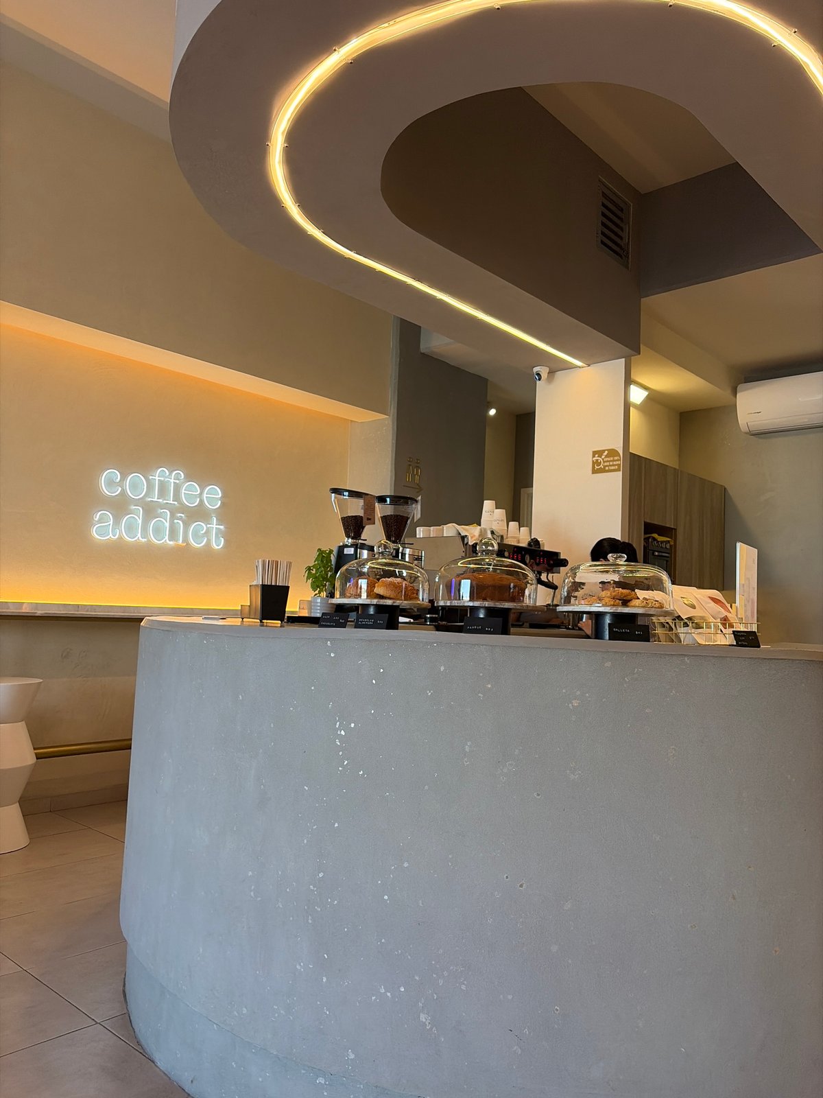 Modern minimalist coffee shop interior documented in evening hours