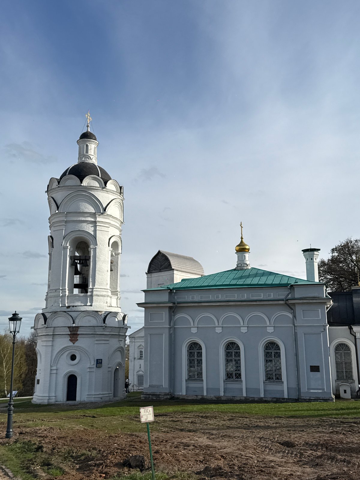 Tourists explore historic Russian Orthodox churches in Moscow park